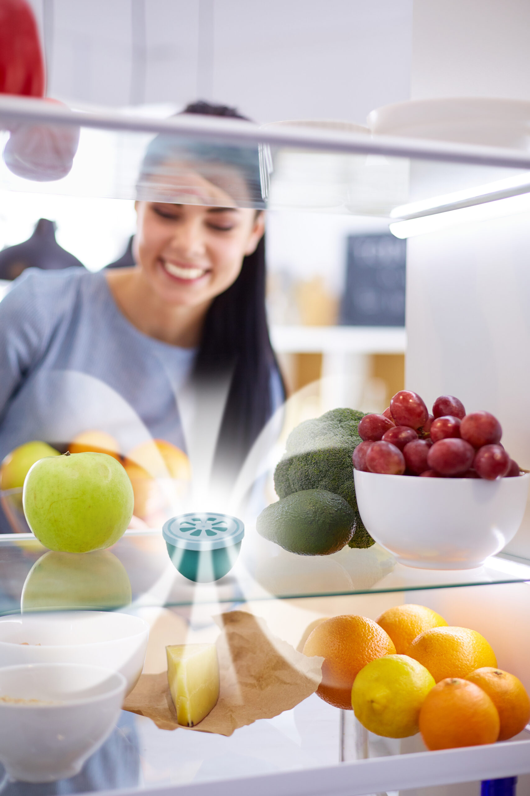 Smiling,Woman,Taking,A,Fresh,Fruit,Out,Of,The,Fridge,